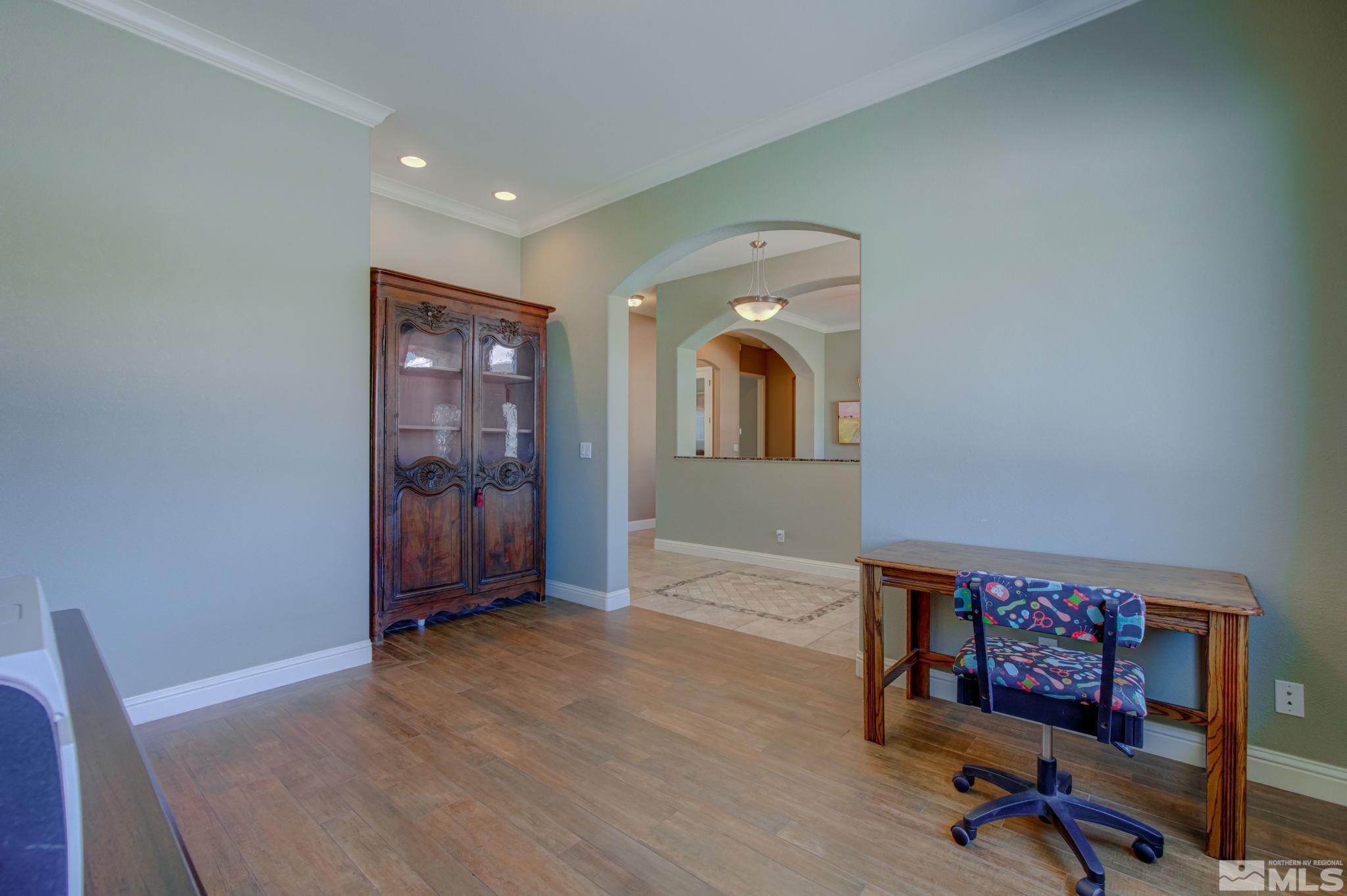 1122 North Fork Trail Minden, NV 89423 - Photo 19 of 40 a view of a livingroom with furniture and a workspace