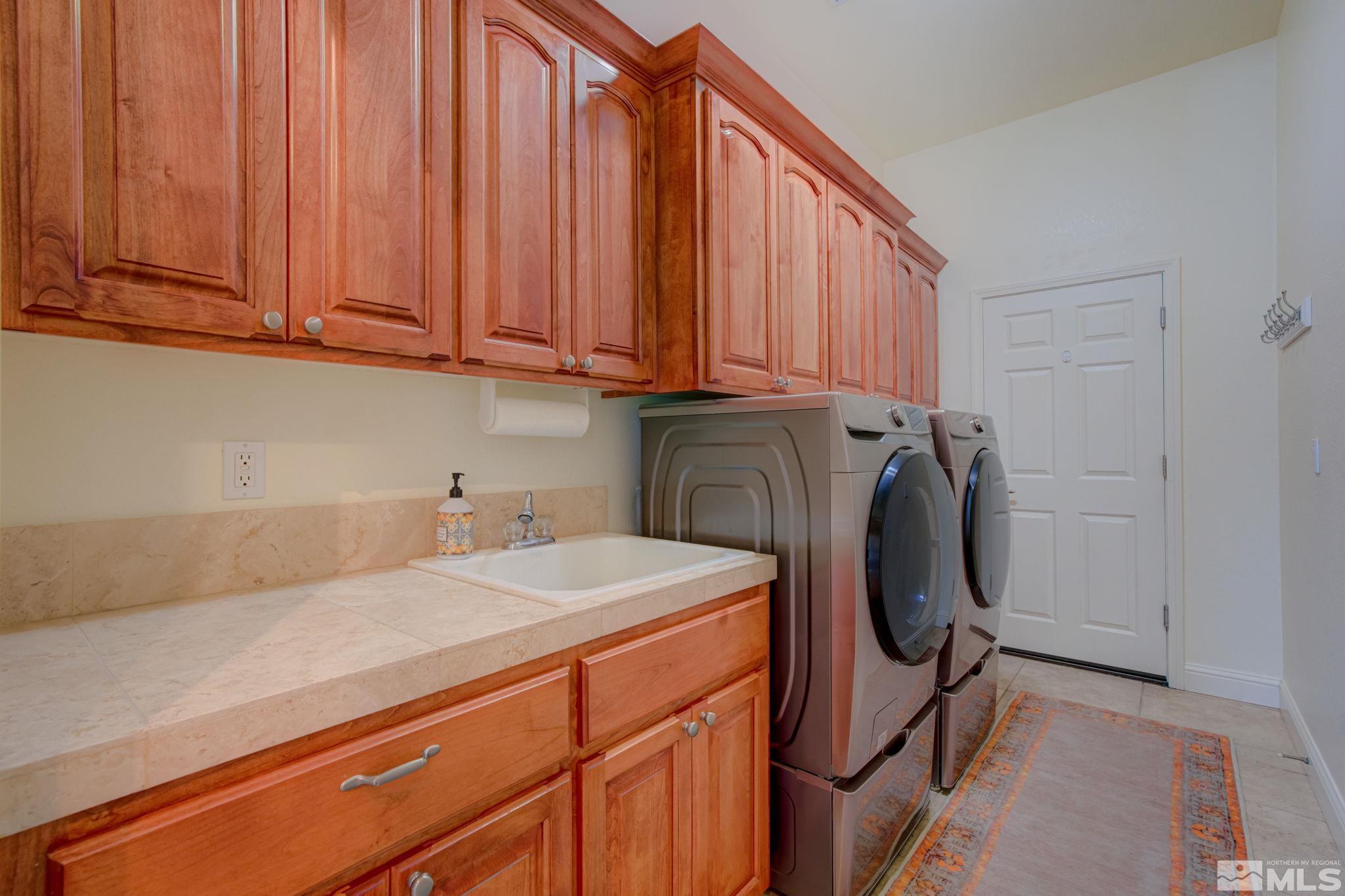 1122 North Fork Trail Minden, NV 89423 - Photo 21 of 40 a utility room with dryer and washer
