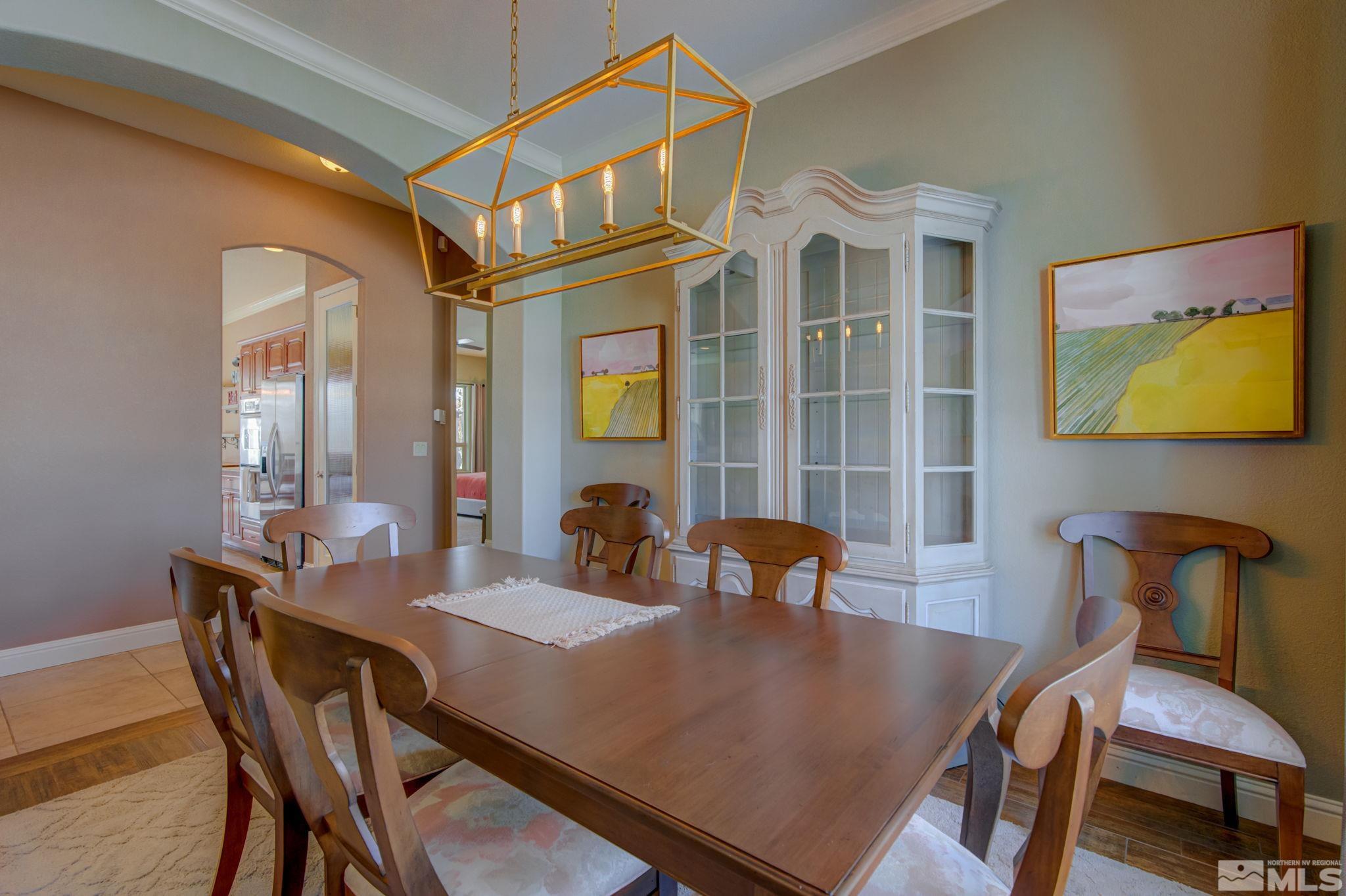 1122 North Fork Trail Minden, NV 89423 - Photo 3 of 40 a view of a dining room with furniture and chandelier