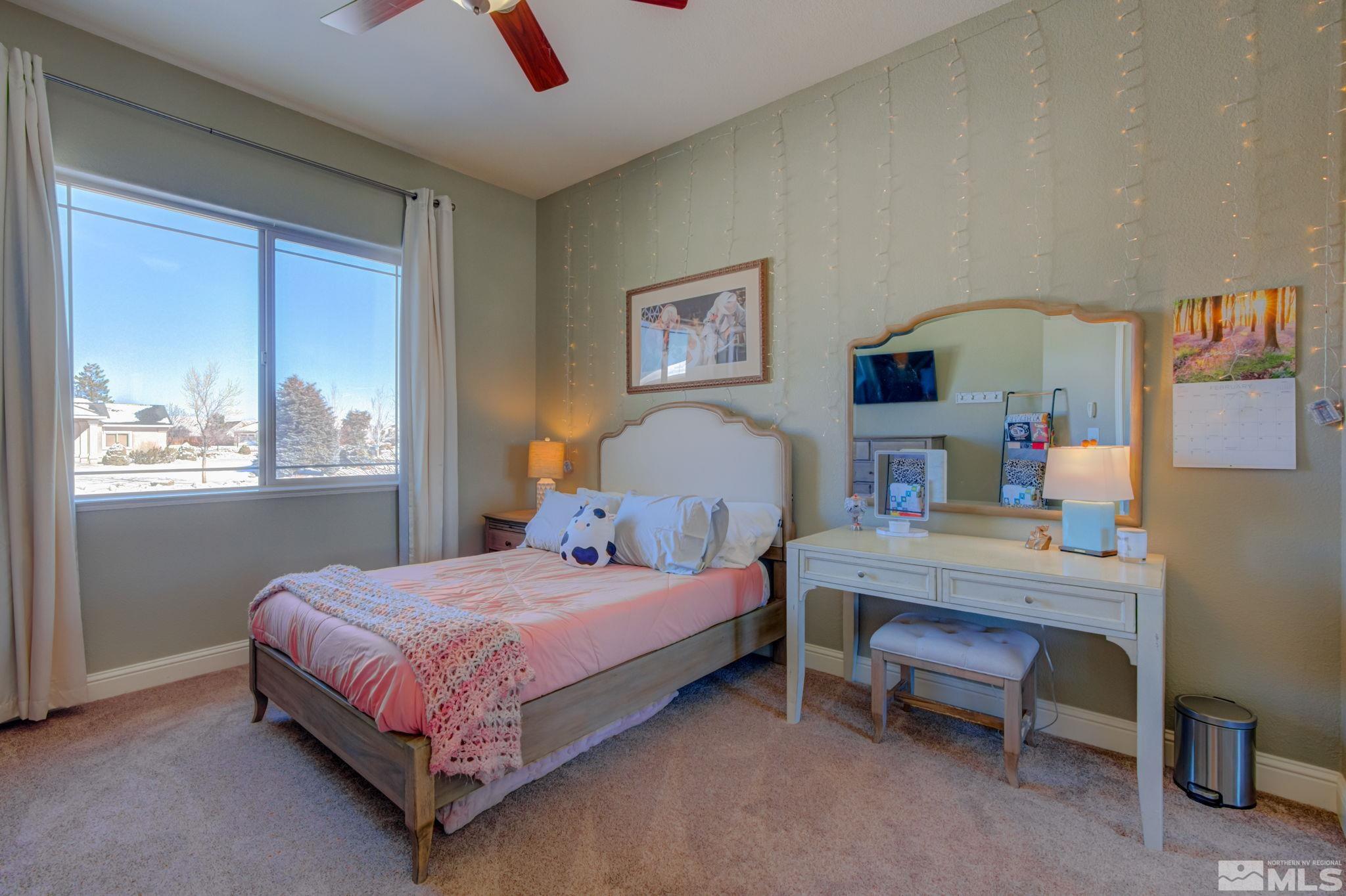 1122 North Fork Trail Minden, NV 89423 - Photo 31 of 40 a bedroom with a bed and a window