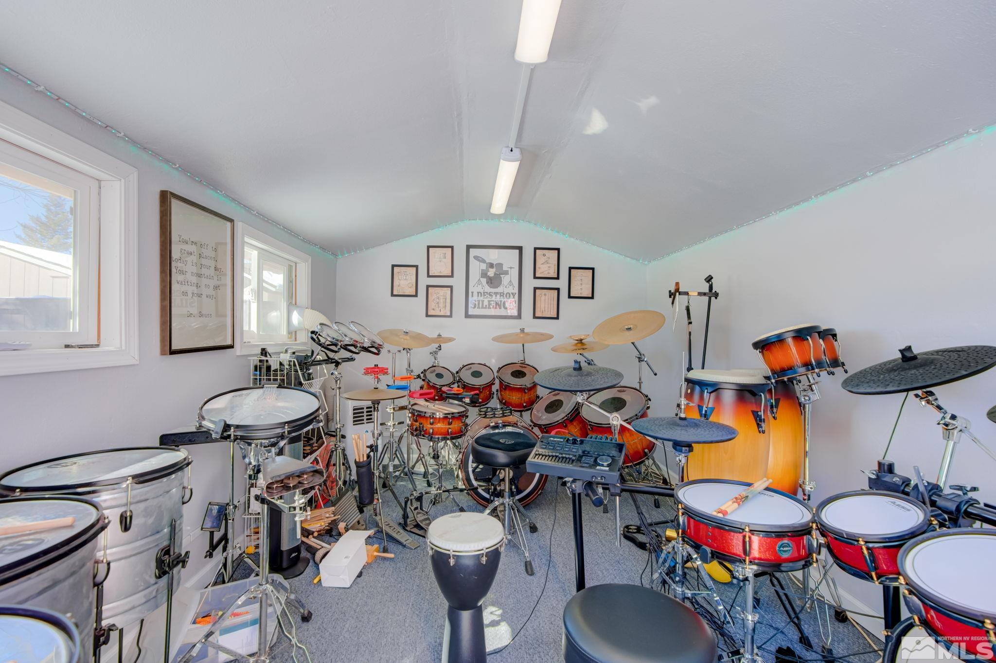 1122 North Fork Trail Minden, NV 89423 - Photo 34 of 40 a room with lots of white furniture and a wooden floor