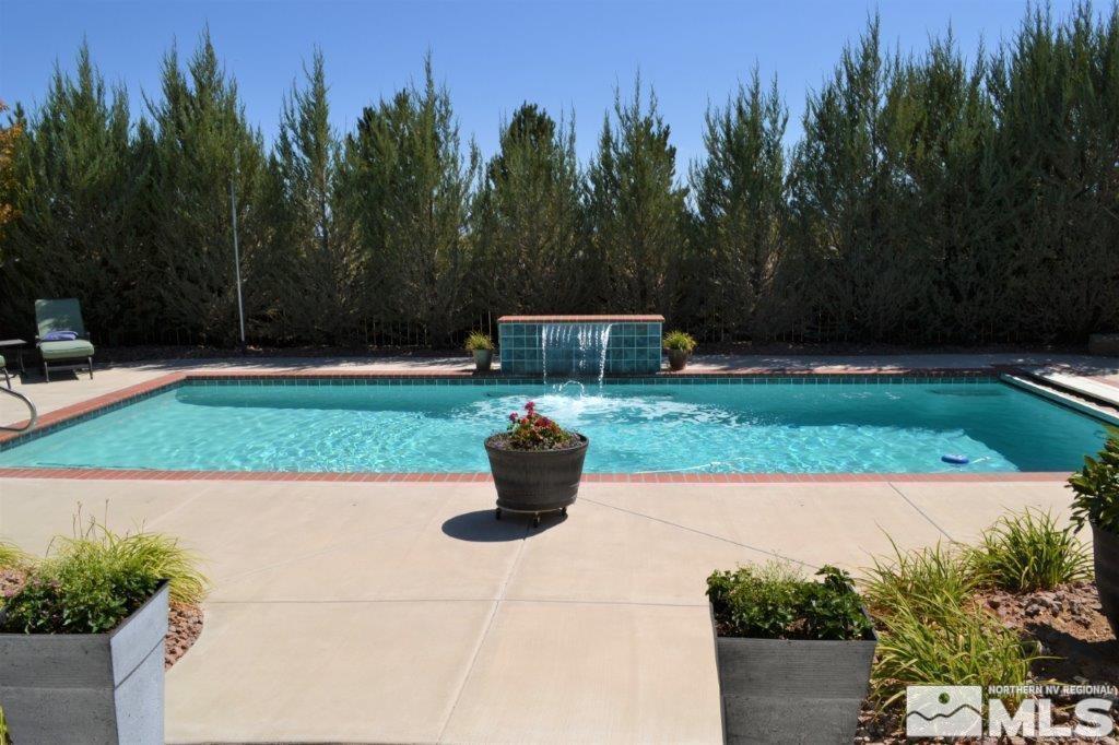 1122 North Fork Trail Minden, NV 89423 - Photo 37 of 40 a view of a garden and basketball court