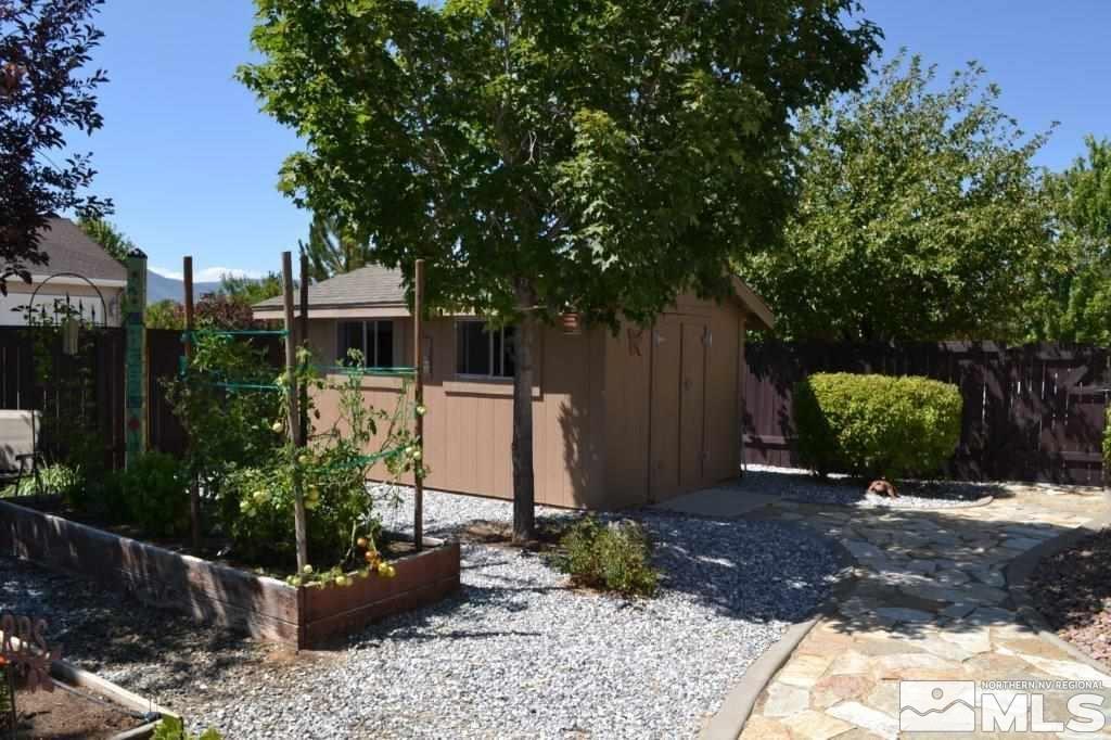 1122 North Fork Trail Minden, NV 89423 - Photo 40 of 40 a view of a backyard with potted plants and large trees