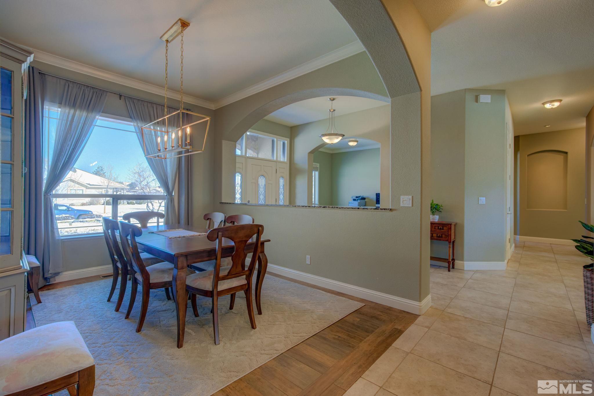 1122 North Fork Trail Minden, NV 89423 - Photo 4 of 40 a view of a dining room with furniture and window
