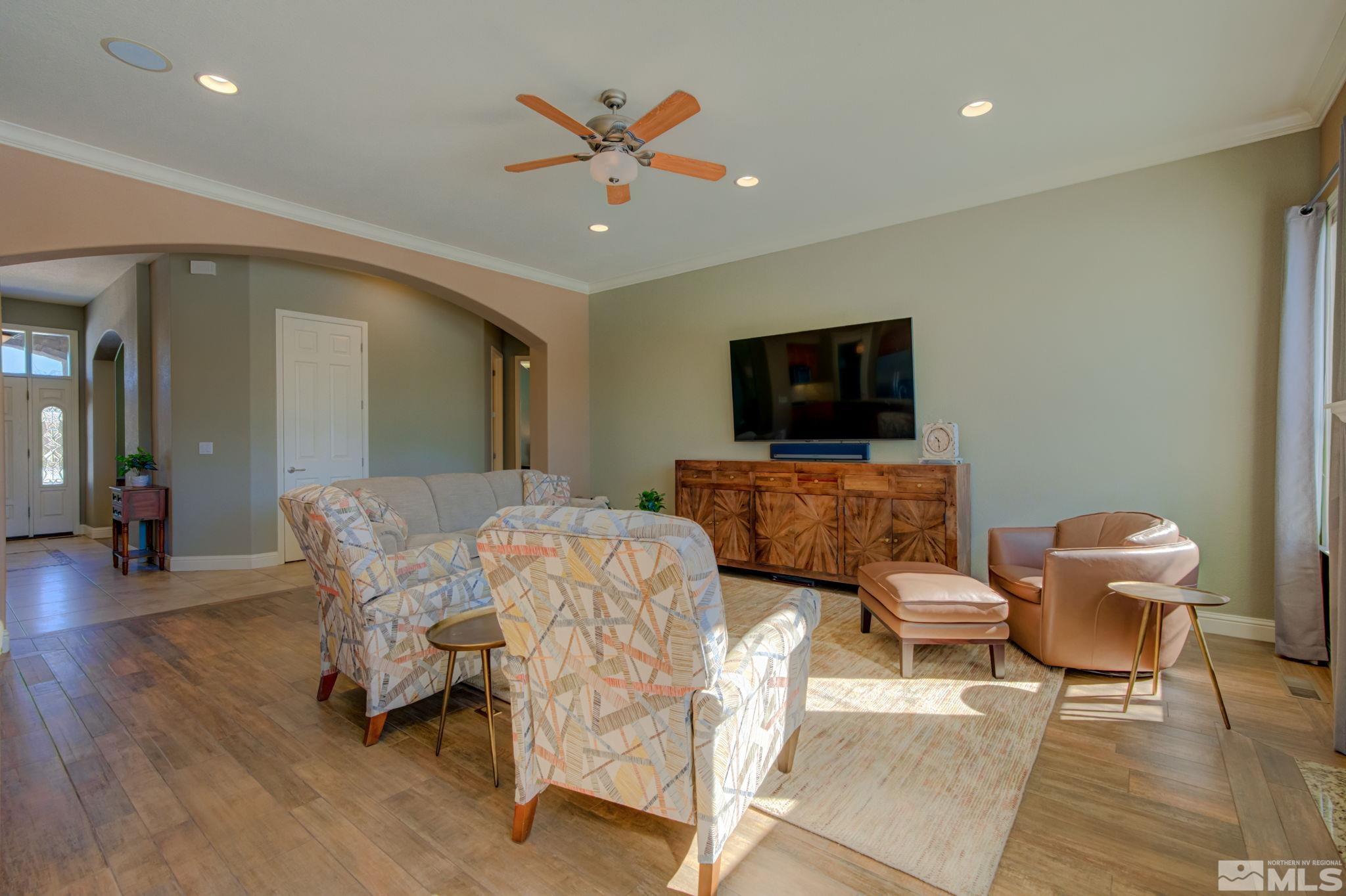 1122 North Fork Trail Minden, NV 89423 - Photo 7 of 40 a living room with furniture and a flat screen tv