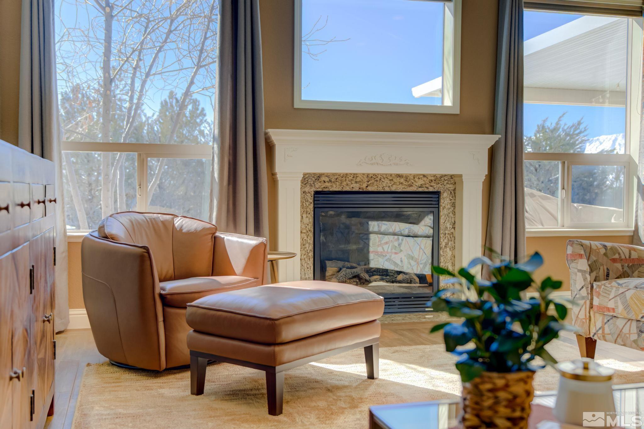 1122 North Fork Trail Minden, NV 89423 - Photo 9 of 40 a living room with furniture a window and a fireplace