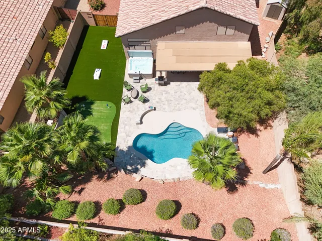 a view of a swimming pool with chairs