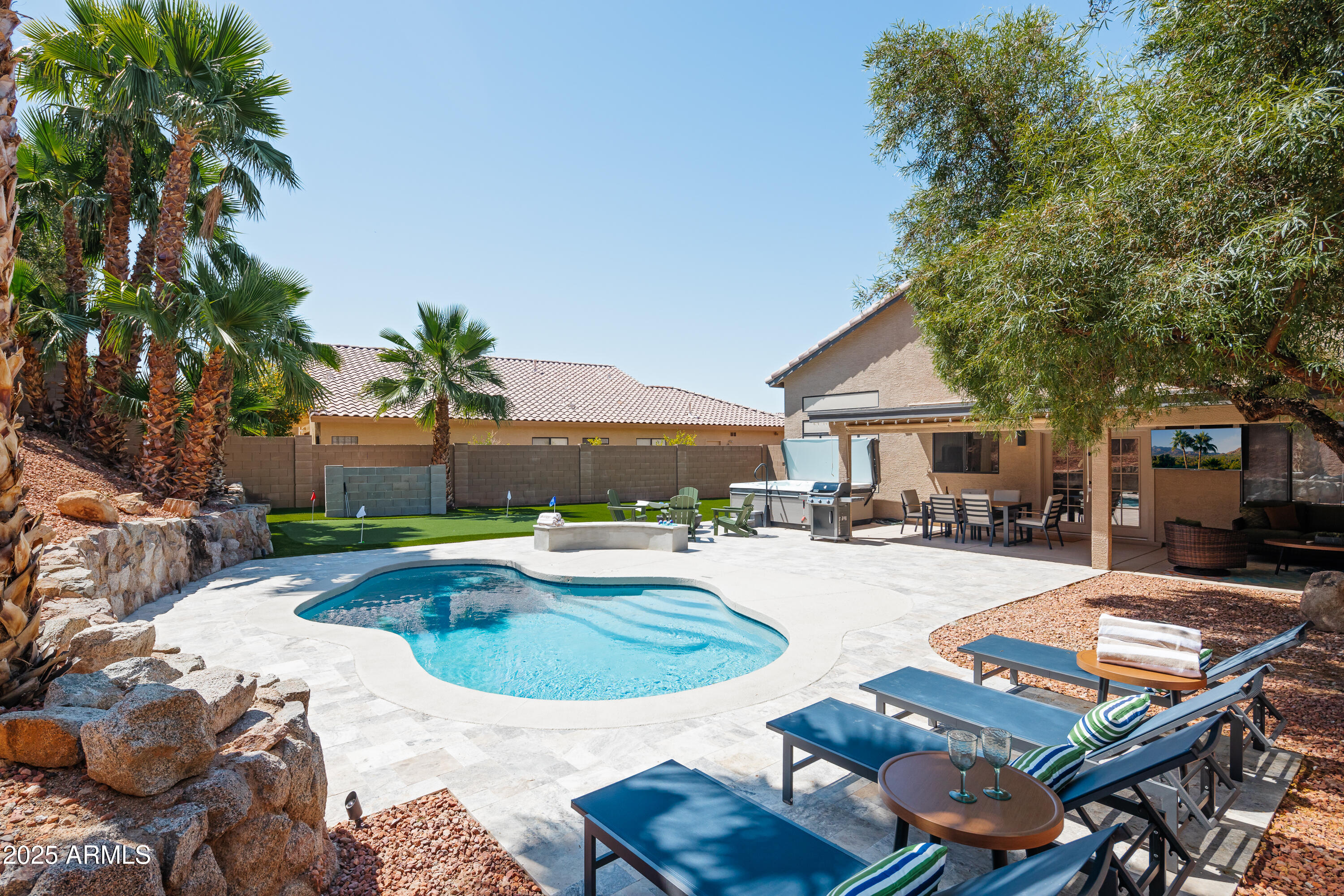 20619 North 16th Way Phoenix, AZ 85024 - Photo 12 of 64 a swimming pool with outdoor seating and yard