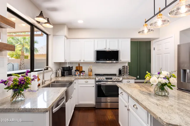 a room with a table and a potted plant