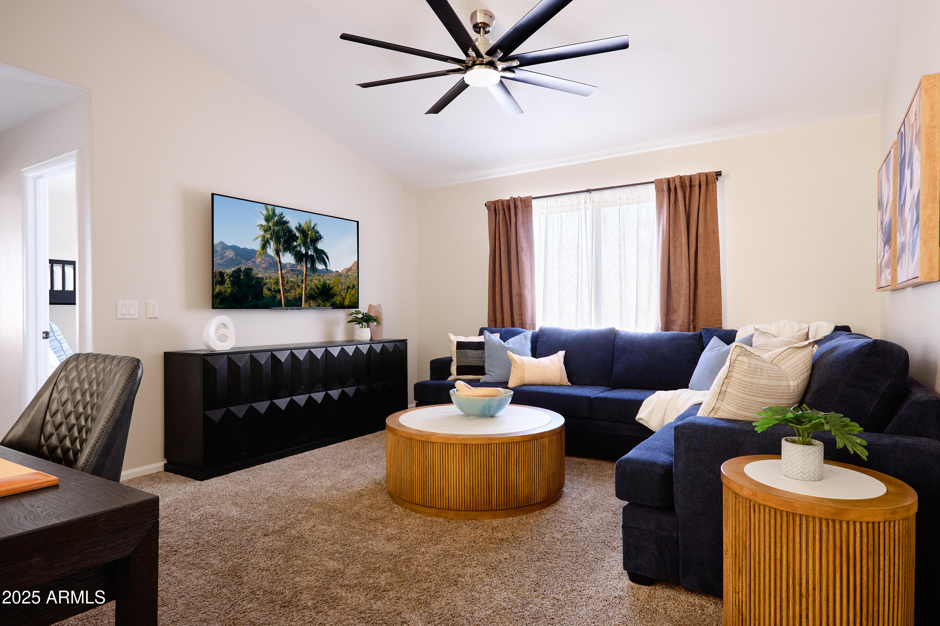20619 North 16th Way Phoenix, AZ 85024 - Photo 24 of 64 a living room with furniture and a flat screen tv