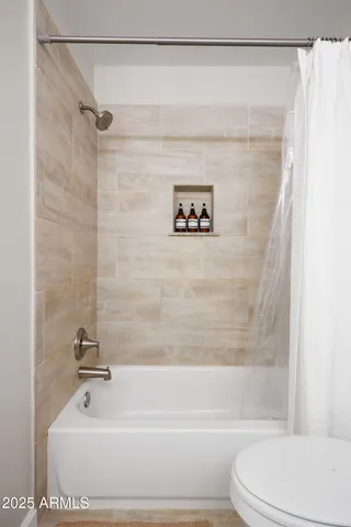 a kitchen with a sink window and cabinets