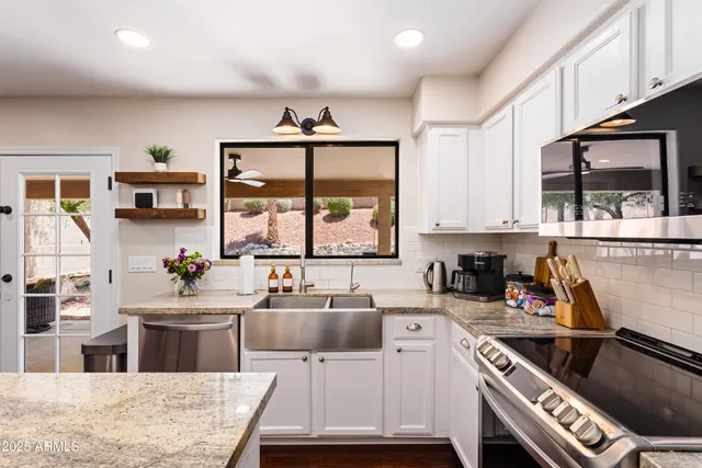 a living room with furniture a rug and a flat screen tv