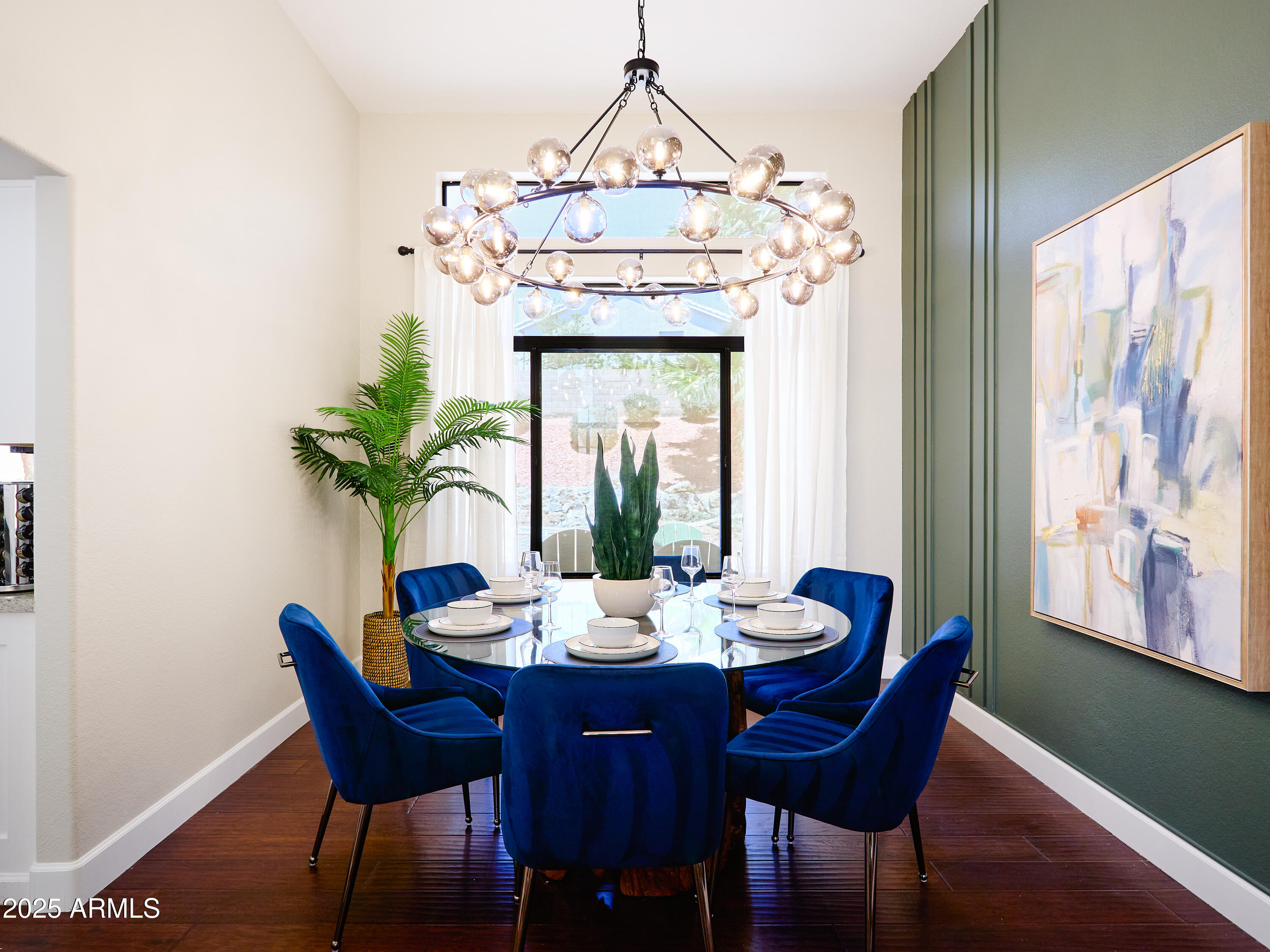 20619 North 16th Way Phoenix, AZ 85024 - Photo 6 of 64 a dining room with furniture potted plants and wooden floor