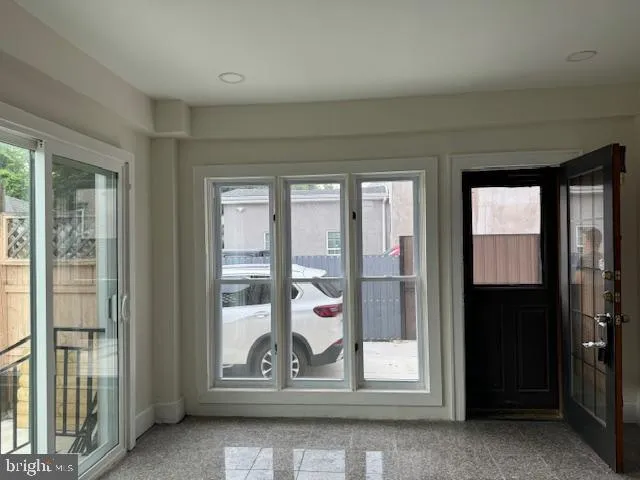 a view of kitchen with furniture and wooden floor