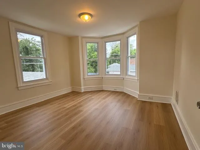 a bathroom with a toilet sink and a mirror