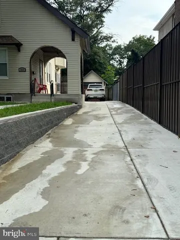 a view of a yard in front view of a house