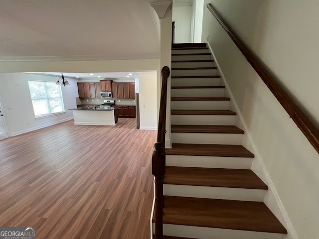 5375 Rialto Way Cumming, GA 30040 - Photo 11 of 42 a view of entryway and hall with wooden floor