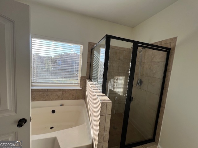 5375 Rialto Way Cumming, GA 30040 - Photo 17 of 42 a bathroom with a bathtub and a shower