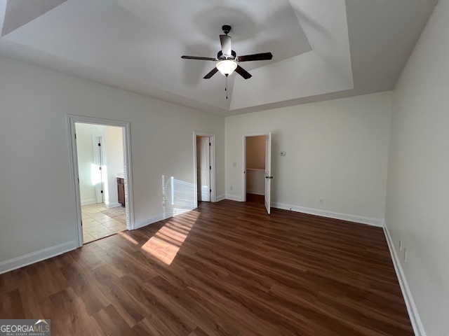 5375 Rialto Way Cumming, GA 30040 - Photo 18 of 42 a view of an empty room with wooden floor and a ceiling fan