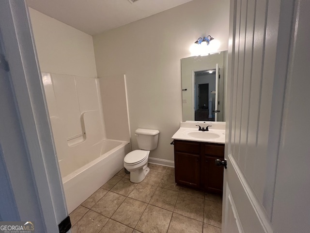 5375 Rialto Way Cumming, GA 30040 - Photo 25 of 42 a bathroom with a sink vanity granite toilet and shower