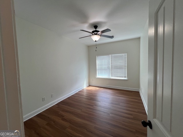 5375 Rialto Way Cumming, GA 30040 - Photo 39 of 42 a view of an empty room with wooden floor and a window