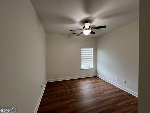 5375 Rialto Way Cumming, GA 30040 - Photo 41 of 42 wooden floor in an empty room with a window