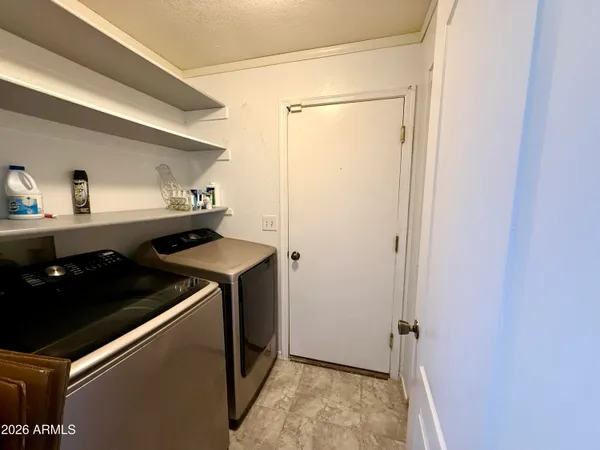 a kitchen with a sink and a refrigerator