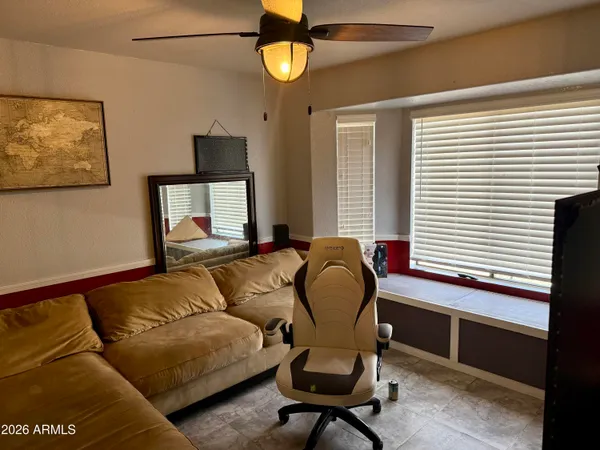 a living room with furniture and a window