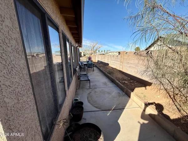 a view of a backyard with sitting area