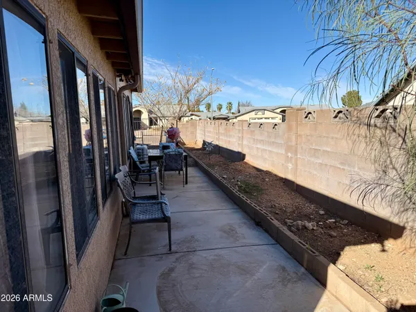 a view of a chairs and table in the patio