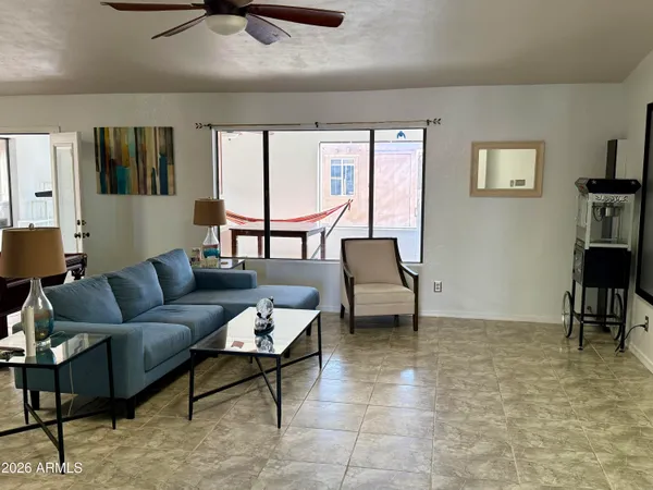 a living room with furniture and a window