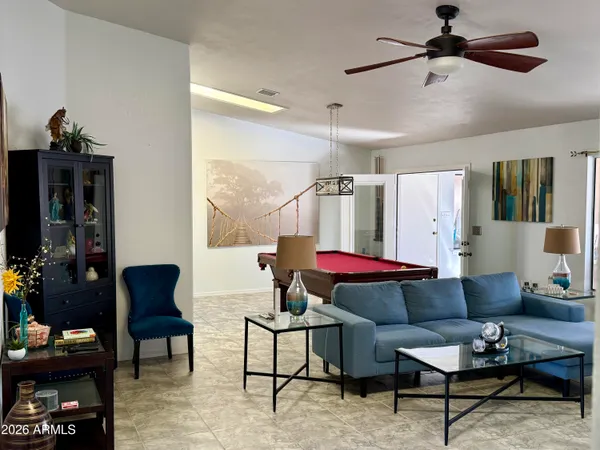 a living room with furniture and a rug