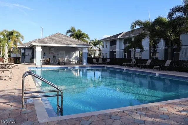 a swimming pool view with a garden view