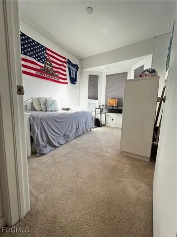 a bedroom with furniture and a gate