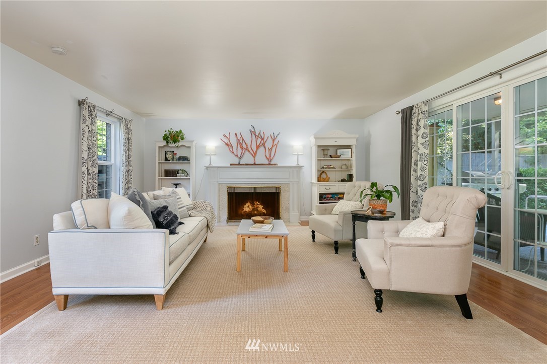 13546 Sherman Road Northwest Seattle, WA 98177 - Photo 3 of 33 a living room with furniture and a fireplace