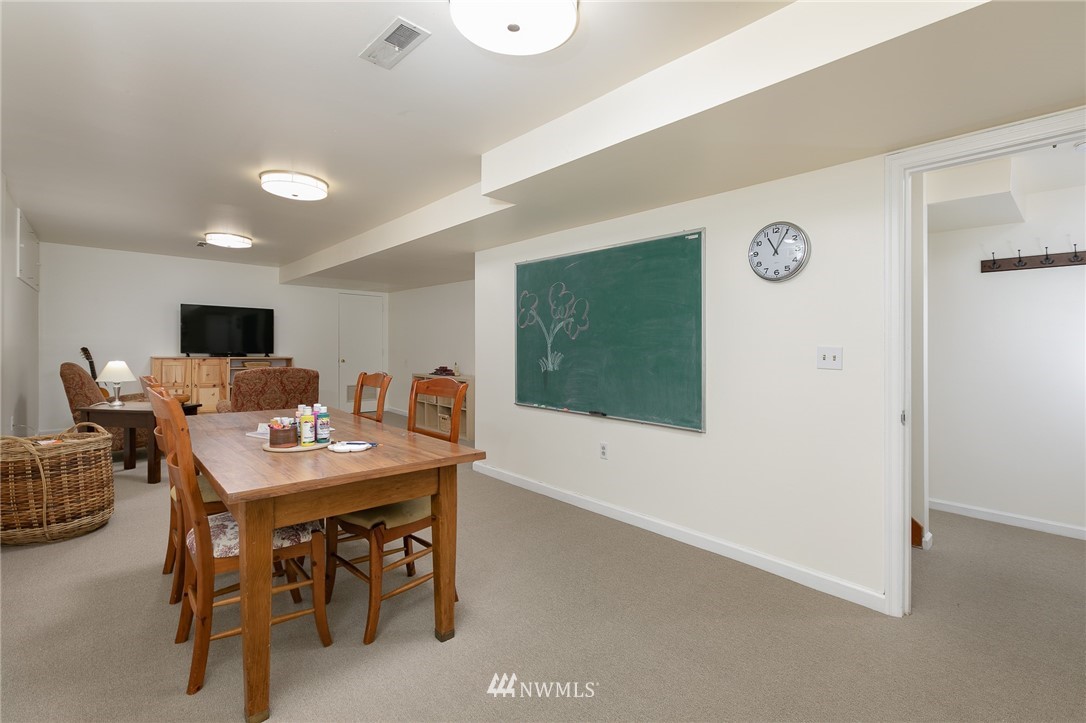 13546 Sherman Road Northwest Seattle, WA 98177 - Photo 22 of 33 a view of a dining room with furniture