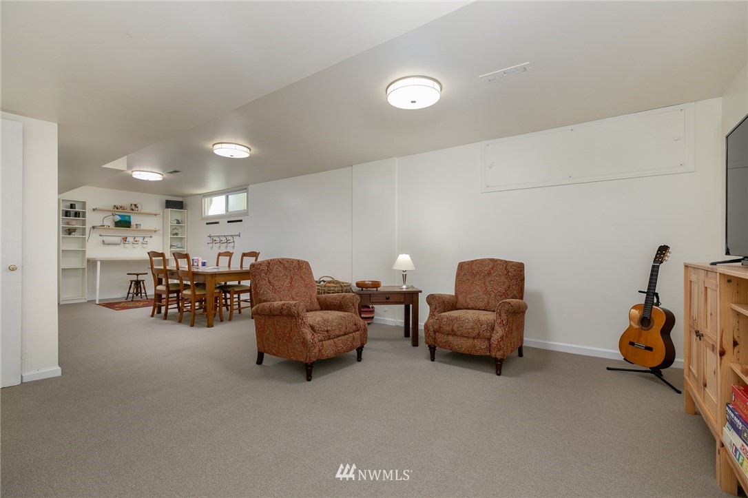13546 Sherman Road Northwest Seattle, WA 98177 - Photo 23 of 33 a living room with furniture and a large window