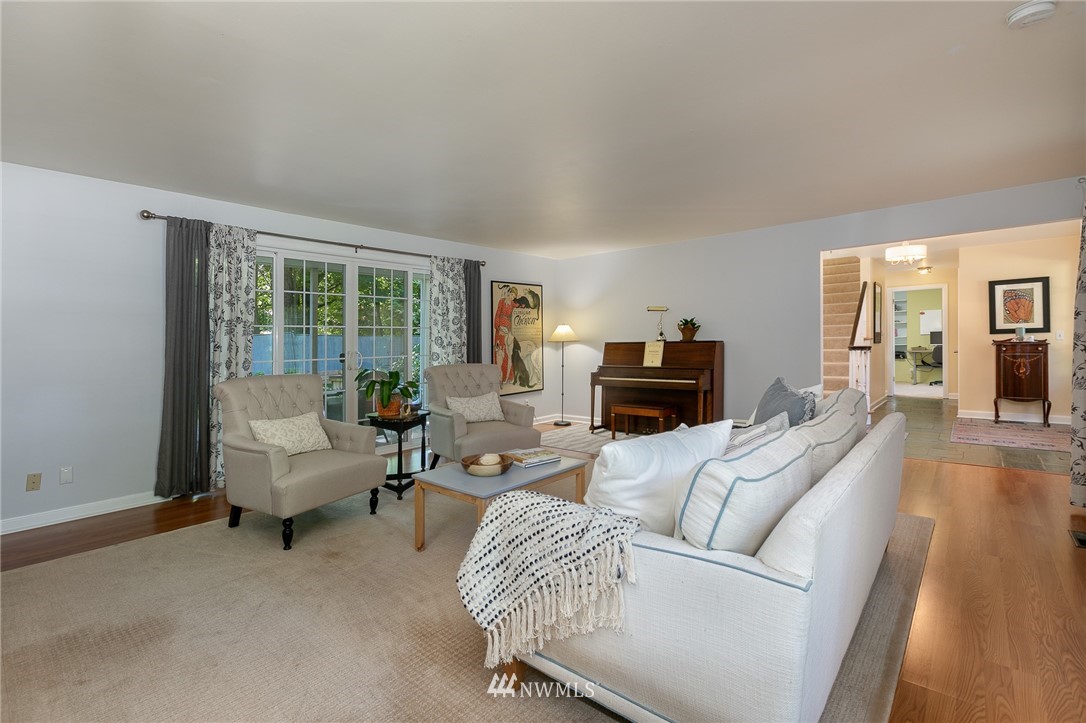 13546 Sherman Road Northwest Seattle, WA 98177 - Photo 5 of 33 a living room with furniture and a fireplace