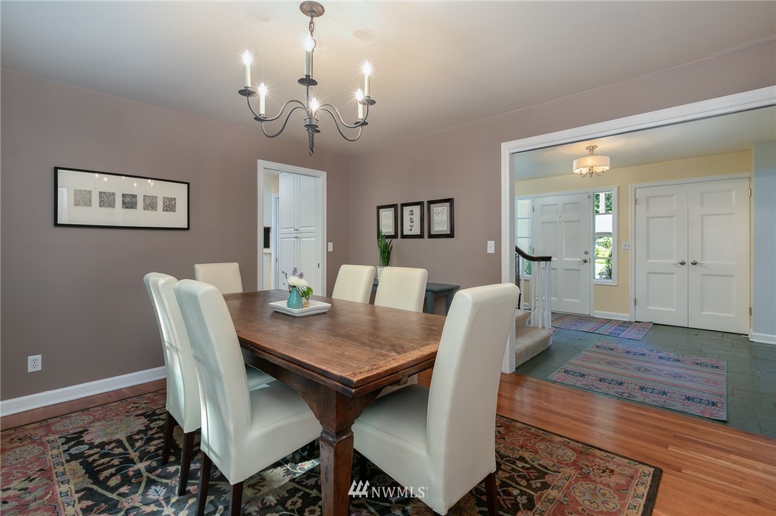 13546 Sherman Road Northwest Seattle, WA 98177 - Photo 6 of 33 a view of a dining room with furniture and wooden floor