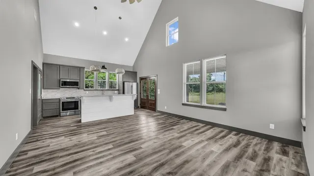 a view of a kitchen with a sink and a window