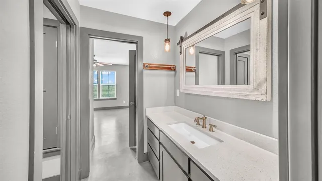 a bathroom with a sink and a mirror