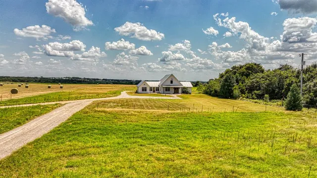 a view of a swimming pool with an outdoor space and seating area
