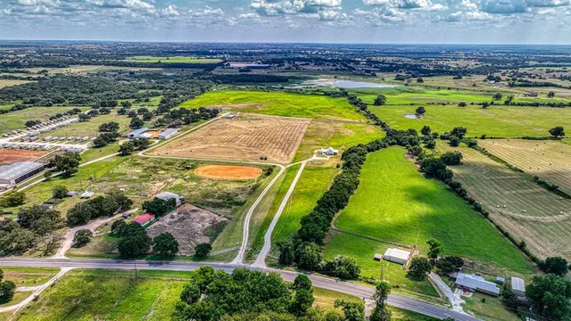 a view of a swimming pool with a yard