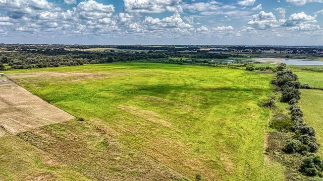 a view of a swimming pool with a yard