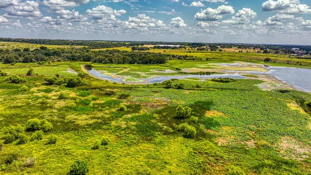 a view of a lake with a building in the background
