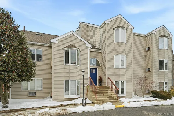 a front view of a house with garage