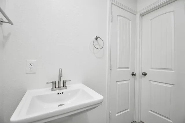 a bathroom with a sink and vanity