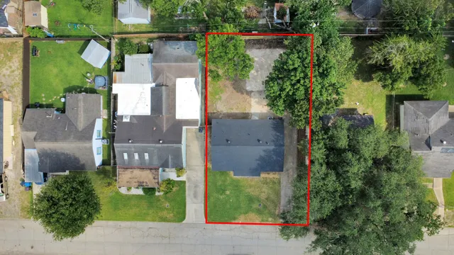 an aerial view of houses with yard