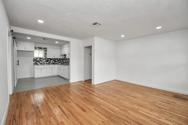 a view of kitchen and kitchen with wooden floor