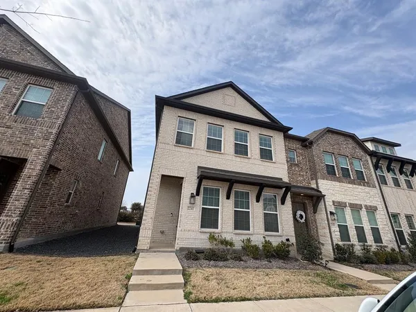 a front view of a house with yard